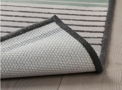 a bay int he philippines with high cliffs, several boats, and bright blue water